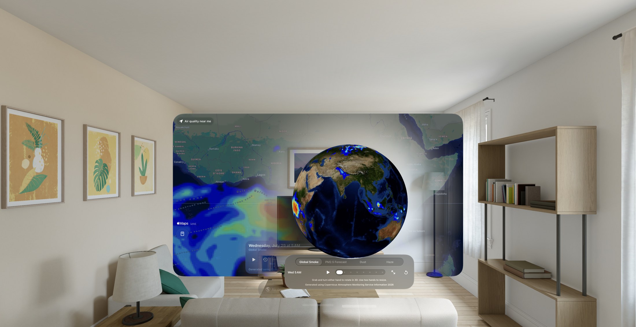 The Air Globe on Apple Vision Pro: a volumetric window holding a three-dimensional Earth with the global smoke forecast rendered over it, floating in a living room in front of the app’s map window. An ornament below the globe carries a layer picker set to Global Smoke and a forecast timeline.